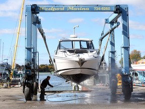 An employees with Westport Marina in LaSalle, Ont., sprays off a cabin cruiser in October 2016. On Friday, Sept. 7, 2018, LaSalle council announced the $2-million purchase of the marina’s 14 acres of waterfront property just north of Gil Maure Park on Highway 18. The town will take possession of marina Oct. 31, 2019.
