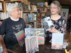 Sarah Jarvis, right, chair of BookFest Windsor 2018: The Power of Story planning committee, gathers with Anne Beer, BookFest founder during a 2018 schedule of authors announcement at Biblioasis on Wyandotte Street East October 3, 2018.  BookFest Windsor 2018: The Power of Story runs from October 17-21, 2018 and will offer bestselling authors Sandra Gulland, Elly Blake and Sharon Butala.  Also this year, BookFest Windsor is expanding its francophone component to three days of programming for grade schools and high schools. (NICK BRANCACCIO/Windsor Star).