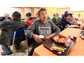 Michael Gabriel Pontich, 50, enjoys a turkey dinner with hundreds of others at downtown Windsor's Salvation Army on Oct. 7, 2018.