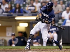 MILWAUKEE, WI - SEPTEMBER 19:  Curtis Granderson #28 of the Milwaukee Brewers flies out in the fifth inning against the Cincinnati Reds at Miller Park on September 19, 2018 in Milwaukee, Wisconsin.