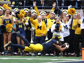 Ronnie Bell of the Michigan Wolverines dives for a first half touchdown while playing the Maryland Terrapins on Oct. 6, 2018 at Michigan Stadium in Ann Arbor, Michigan.