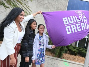 Nour Hachem, left, Vanessa Vu, 13, and her sister Vanna Vu, 14, pose during a flag-raising ceremony at the International Day of the Girl and City of Windsor's Dreamer Day at city hall October 11, 2018. The flag ceremony followed a sold-out breakfast, awards and fireside chat with guest speakers.