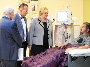 Dialysis patient Bryan Deane, right, of Windsor speaks with Helga Reidel, CEO Enwin Utilities, Ray Tracey, CEO Essex Power Corp. and Ron Foster, left, of Windsor Regional Hospital, following a generous donation of $66,700 to the WRH Renal Dialysis Building on Goyeau Street October 15, 2018. The donation was raised from the 6th annual EDA (Electricity Distributors Association) Western District Charity Golf Tournament and the funds will go toward purchase of new dialysis chairs.