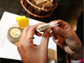 Cannabis is rolled at Higher Limits Lounge on Ouellette Avenue Oct. 17, 2018.
