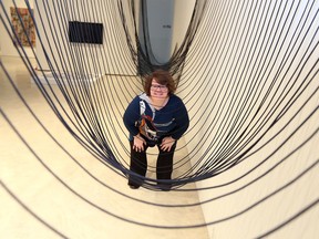 Dr. Jaclyn Meloche, Curator of Contemporary Art at the Art Gallery of Windsor views an installation by artist Quinn Smallboy, part of The Living River Project: Art, Water and Possible Worlds at AGW October 18, 2018.