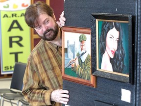 Artist Marian Klimowicz is shown Oct. 19, 2018, with two of his pieces, A Man With A Flute and Vanessa, which are among the 175 original local artworks on display at the 40th annual Association of Representational Artists of Windsor Essex art show and sale at Windsor Crossing Outlet Mall. This year's juried theme is "Positively Windsor Essex."