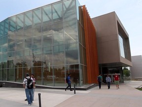 University of Windsor students walk outside the Ed Lumley Centre for Engineering Innovation on May 30, 2013.