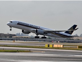 (FILES) In this file photo taken on March 28, 2018 a Singapore Airlines (SIA) Airbus A350 aircraft takes off from the Changi Airport in Singapore. - A new Singapore Airlines route connecting the city-state to New York goes into operation on October 11, becoming the longest commercial plane ride in the world.