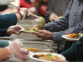 The Salvation Army in Windsor will be serving up its first Thanksgiving dinner this weekend. Here, patrons get served art a turkey dinner in Cottam for American Thanksgiving in 2017.