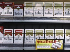 Marlboro Gold and other Marlboro varieties of cigarettes are displayed in a Little Rock, Ark., store on October 23, 2013. Shares of Aphria Inc. soared on Wednesday in the wake of a media report that said U.S. tobacco giant Altria Group Inc. was in talks with the licensed cannabis producer to acquire an equity stake.