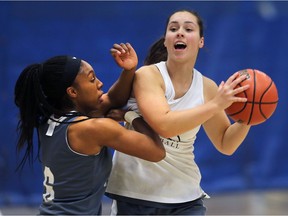 WINDSOR, ON. OCTOBER 30, 2018. --  University of Windsor's Tyra Blizzard, left, and Carly Steer are shown during practice on Tuesday, October 30, 2018 at the St. Denis Centre.