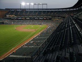 The Baltimore Orioles and Toronto Blue Jays play in the first inning of a baseball game on Sept. 19, 2018, at Oriole Park at Camden Yards in Baltimore.