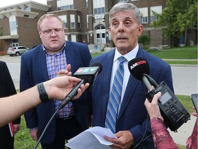 Eric Renaud, left, a candidate for trustee with the Windsor Essex Catholic District School Board and Alan Halberstadt a candidate for trustee with the Greater Essex County District School Board speak to reporters about the benefits of a merger of the two boards during a press conference on Wednesday, October 3, 2018, in Windsor.