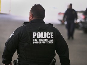 U.S. Customs and Border Protection officers are shown in the secondary inspection area on Oct. 17, 2018.