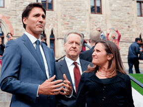 Prime Minister Justin Trudeau with Foreign Affairs Minister Chrystia Freeland and chief Canadian trade negotiator Steve Verheul.