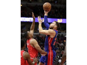 Detroit Pistons forward Blake Griffin, right, shoots against Chicago Bulls forward Jabari Parker during the first half of an NBA basketball game Saturday, Oct. 20, 2018, in Chicago.
