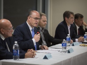 Mayoral candidates, from left, Ernie Lamont, Mayor Drew Dilkens, Frank Dyck, Matt Marchand, and Tom Hensel, participate in a debate hosted by the Canadian Federation of University Women at the WFCU Centre, Wednesday, Oct. 3, 2018.