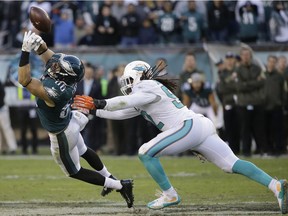 Linebacker Kelvin Sheppard, seen at right during his days with the Miami Dolphins, was signed by the Detroit Lions on Wednesday to fill the roster spot left vacant after Tuesday's trade of Golden Tate to Philadelphia.