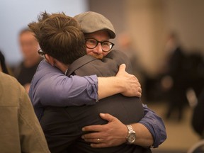 Ward 4 councillor, Chris Holt, gets a hug from Ward 5 candidate, Joey Wright, at the St. Clair Centre for the Arts on Oct. 22,  2018.