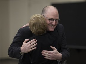 Mayor Drew Dilkens gets a hug from chief-of-staff Norma Coleman at the St. Clair Centre for the Arts, Monday, Oct. 22,  2018.