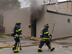 Windsor firefighters are shown on the scene of a structure fire on Friday, Oct. 26, 2018 in the 400 block of Tuscarora Street.