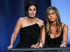 Courteney Cox, left, and Jennifer Aniston speak onstage during the American Film Institute's 46th Life Achievement Award Gala Tribute to George Clooney at Dolby Theatre on June 7, 2018 in Hollywood, Calif. (Kevin Winter/Getty Images for Turner)