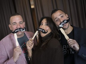 Greg Grondin, left, owner of HL Heritage Brewing Company, Houida Kassem, executive director of the Windsor Cancer Centre Foundation, and Tony Smith owner of Garage Gym, sport Grow On mustaches during the Grow On launch at the Windsor Club on Oct. 26, 2018.