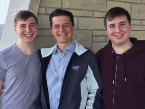 Mayor Aldo DiCarlo and twin sons Michael (left) and Vincent are seen after they voted at the Libro Centre in Amherstburg. The boys turned 18 last week so were voting for the first time.
