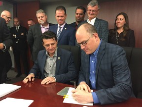 Amherstburg Mayor Aldo DiCarlo and Windsor Mayor Drew Dilkens signed the official contract Friday for Windsor to take over policing duties in the town. The 20-yearcontract, with terms up for review every five years, will take effect at midnight on Jan. 1, 2019.