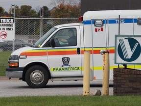 An ambulance leaves the Ventra Plastics site at 2800 Kew Dr. in Windsor on Nov. 3, 2016. Rob Morneau, an electrical worker, fell to his death while working on the building. Construction contractor Vollmer Inc. has been fined $150,000 after pleading guilty to a violation under Ontario's Construction Projects Regulation.
