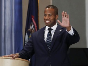 Republican John James waves before the debate with Sen. Debbie Stabenow, D-Mich., at the Detroit Economic Club, Monday, Oct. 15, 2018, in Detroit. Stabenow is seeking a fourth term and has led comfortably in polls, and James, a business executive and combat veteran, participated in their second debate before the November election.