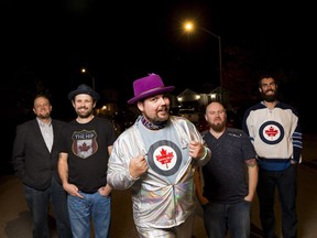 The Artificially Hip, a Tragically Hip tribute band, from left, Simon McIntyre, Mat Bowman, William Bishop, Dave Guenard and Brad Rigby pose for a photo Thursday, October 11, 2018 outside of their rehearsal space in Cambridge, Ont.