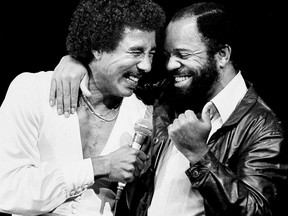 FILE - In this June 15, 1981 file photo, Smokey Robinson, left, is joined by Berry Gordy at the Greek Theater in Los Angeles. The music of Motown still beguiles audiences around the globe, but the music isn't heard regularly in Detroit, the city of its birth. Singer Joan Belgrave is trying to change that. She's brought it to many venues and hopes to secure a place "dedicated to the genre."