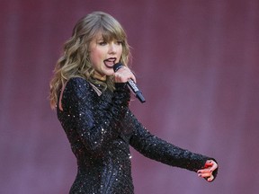 FILE - In this June 22, 2018, file photo, singer Taylor Swift performs on stage in concert at Wembley Stadium in London.