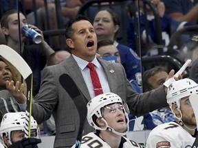 Florida Panthers coach Bob Boughner yells from the bench during the third period of an NHL hockey game against the Tampa Bay Lightning Saturday, Oct. 6, 2018, in Tampa, Fla.