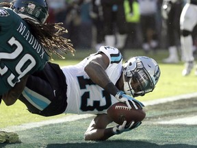 Carolina Panthers wide receiver Jarius Wright (13) dives in for a two-point conversion pass from quarterback Cam Newton, not pictured, as Philadelphia Eagles cornerback Avonte Maddox (29) tries to stop him during the second half of an NFL football game, Sunday, Oct. 21, 2018, in Philadelphia.
