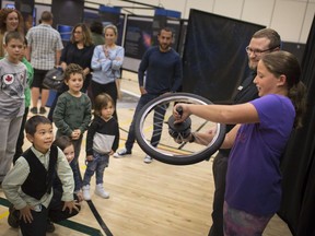 Celeste Deschamps, 11, a grade 6 student at Monseigneur-Augustin-Caron elementary school, takes part in a lesson about angular velocity by Roger Wilkinson during the Powers of Ideas Exhibition at Tecumseh Vista Academy, Tuesday, Oct. 2, 2018.  The exhibition is put on by the Perimeter Institute for Theoretical Physics based out of Waterloo.