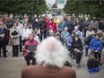 Larry Duffield, president of the local branch of the Canadian Association of Retired Persons, speaks to a group of Seniors at a flag-raising ceremony at City Hall for the United Nations International Day of Elder Persons and Canada Seniors Day, Monday, Oct. 1, 2018.