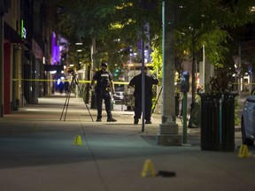 Windsor police investigate an early morning shooting on Ouellette Avenue at Maiden Lane in downtown Windsor on Oct. 5, 2018.