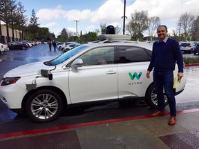 Christopher Shulgan is seen at Google X, the search company's so-called moonshot factory that pioneered self-driving cars, in Mountain View, California, standing alongside a Waymo self-driving Lexus.