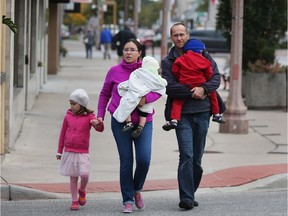 Stroll Windsor capped off its first year of neighbourhood discoveries with a visit to Via Italia on Oct. 13, 2018. Brishen and Stacey Hoff, and their children Milada, 5, Brighton, 3 and David, 10 months, walk down Erie Street during the event.
