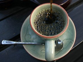 In this photo taken Dec. 3, 2012, the $1,100 per kilogram ($500 per pound) Black Ivory coffee is poured into a cup at a hotel restaurant in Chiang Rai province, northern Thailand. A Canadian entrepreneur with a background in civet coffee has teamed up with a herd of 20 elephants, gourmet roasters and one of the country's top hotels to produce the Black Ivory, a new blend from the hills of northern Thailand and the excrement of elephants which ranks among the world's most expensive cups of coffee.