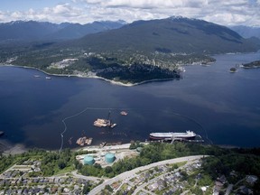 The National Energy Board says it has granted intervenor status to 98 applicants for an upcoming hearing to reconsider approval of the Trans Mountain pipeline expansion project. An aerial view of Kinder Morgan's Trans Mountain marine terminal, in Burnaby, B.C., is shown on May 29, 2018.