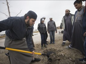 Staff and youth from New Beginnings and the Islamic Academy School lend their help to the Windsor Port Authority to plant 53 native trees along Russell Street in Sandwich Town, Monday, Oct. 30, 2018.  The land is owned by the Port Authority but is leased to Lafarge Canada.