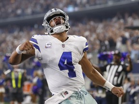 Dallas Cowboys quarterback Dak Prescott (4) celebrates after a touchdown in the first half of an NFL football game against the Jacksonville Jaguars in Arlington, Texas, Sunday, Oct. 14, 2018.