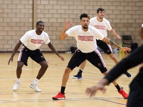 Windsor, Ontario. November 1, 2018.  --  Windsor Express Ryan Anderson, front, leads a group of his teammates during opening drills at the John Atkinson Centre November 1, 2018. The new-look Express went through a variety of stretching and running drills for the first hour of their practice.