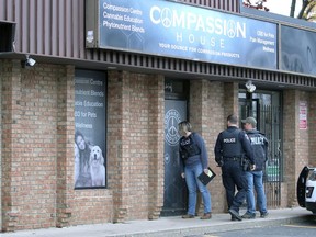 Windsor Police attend Compassion House on Tecumseh Road West Wednesday morning.