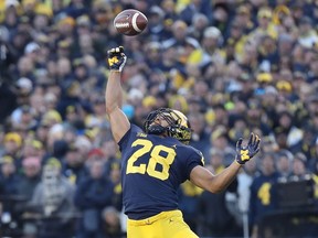 Brandon Watson of the Michigan Wolverines tips the ball during the third quarter of the game against the Penn State Nittany Lions at Michigan Stadium on November 3, 2018 in Ann Arbor, Michigan. Michigan defeated Penn State 42-7.