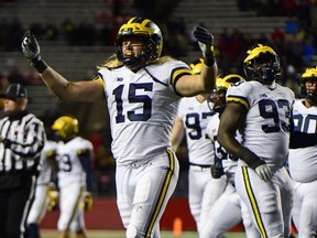 Chase Winovich of the Michigan Wolverines pumps up the crowd against the Rutgers Scarlet Knights during the third quarter at HighPoint.com Stadium on Nov. 10, 2018 in Piscataway, New Jersey. Michigan won 42-7.