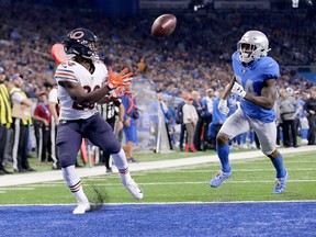 Tarik Cohen of the Chicago Bears catches a touchdown pass in front of Nevin Lawson of the Detroit Lions during the third quarter at Ford Field on Nov. 22, 2018 in Detroit, Michigan.